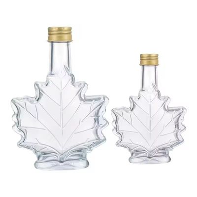 Garrafa de bebida de vidro industrial de cor personalizada com forma de folha de bordo 50 ml 100 ml 250 ml