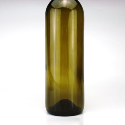Botella de vidro de 750 ml Prime Color para bebidas alcoólicas de vinho tinto Forma redonda Capuz de parafuso de cortiça de cor verde
