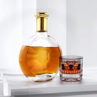 Garrafa de vidro de superfície lisa irregular redonda personalizada para produção de whisky de gin de 700 ml
