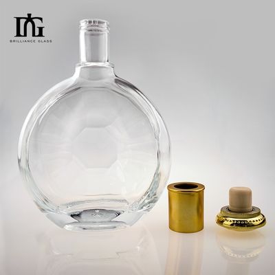 Garrafa de vidro de superfície lisa irregular redonda personalizada para produção de whisky de gin de 700 ml